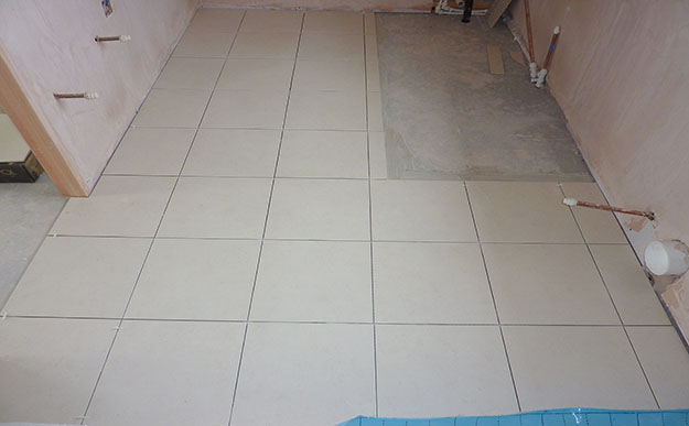 Beige floor tiles ore-grout 